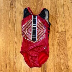 GK Elite Red and Black Gymnastics Leotard with design.